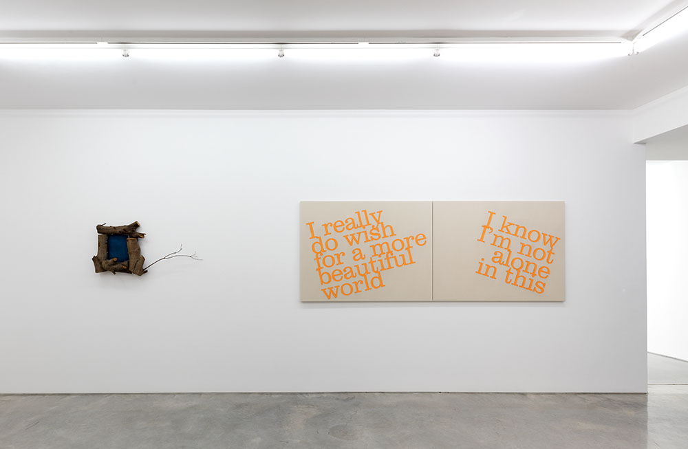 Diptych painting and wooden installation mounted on a white gallery wall